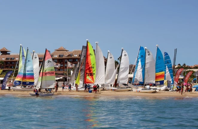 Beachgowers enjoy watersports in islantilla beach